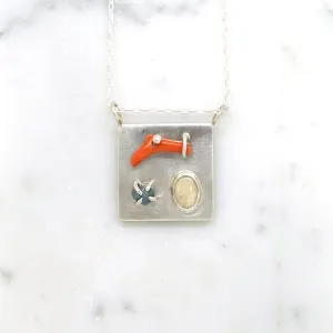 Art pendant necklace with coral, opal, and raw diamond