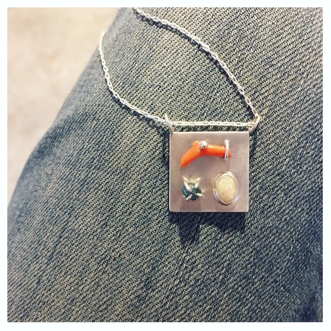 Art pendant necklace with coral, opal, and raw diamond