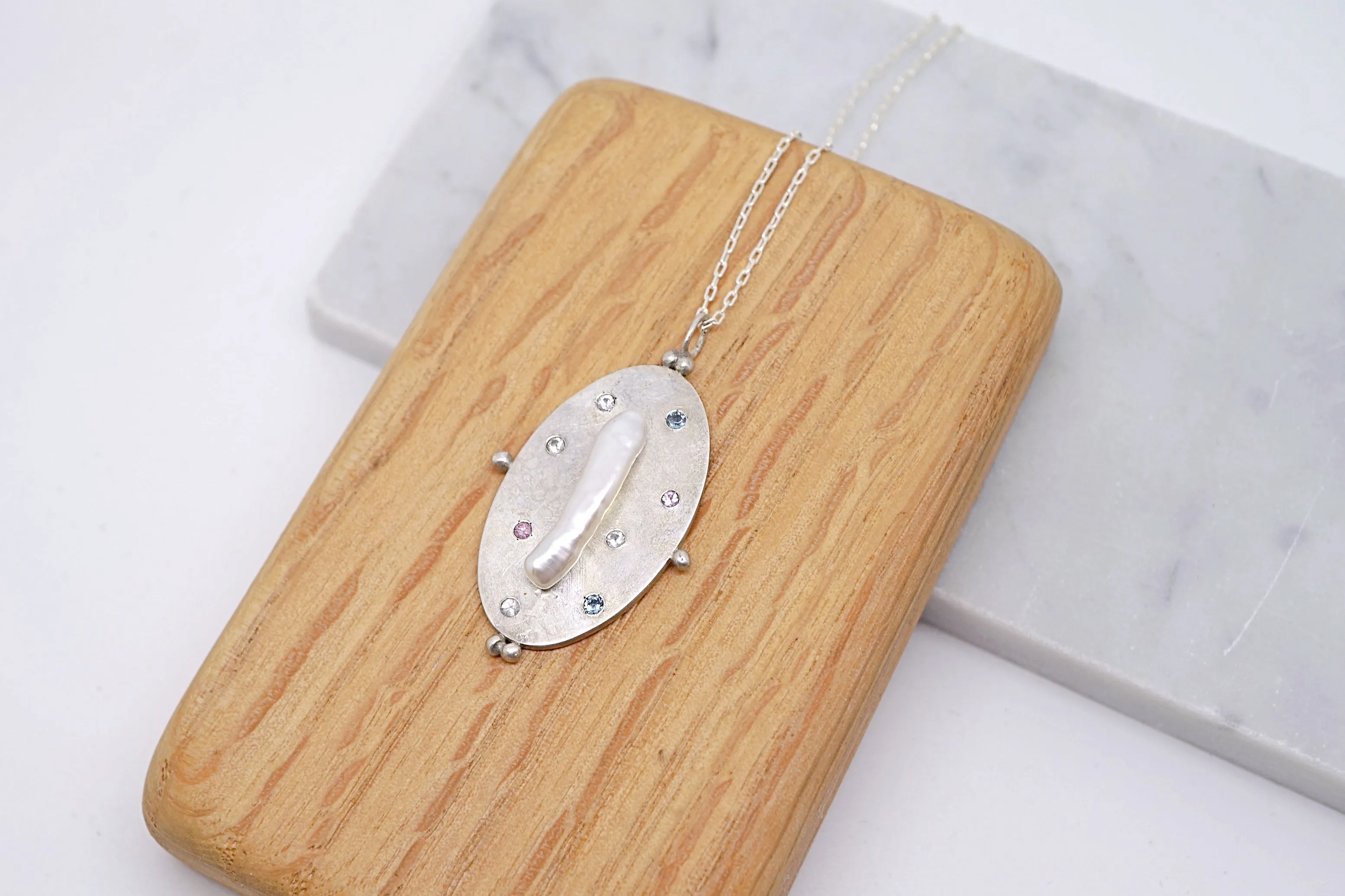 Art pendant necklace with keshi pearl and sapphires