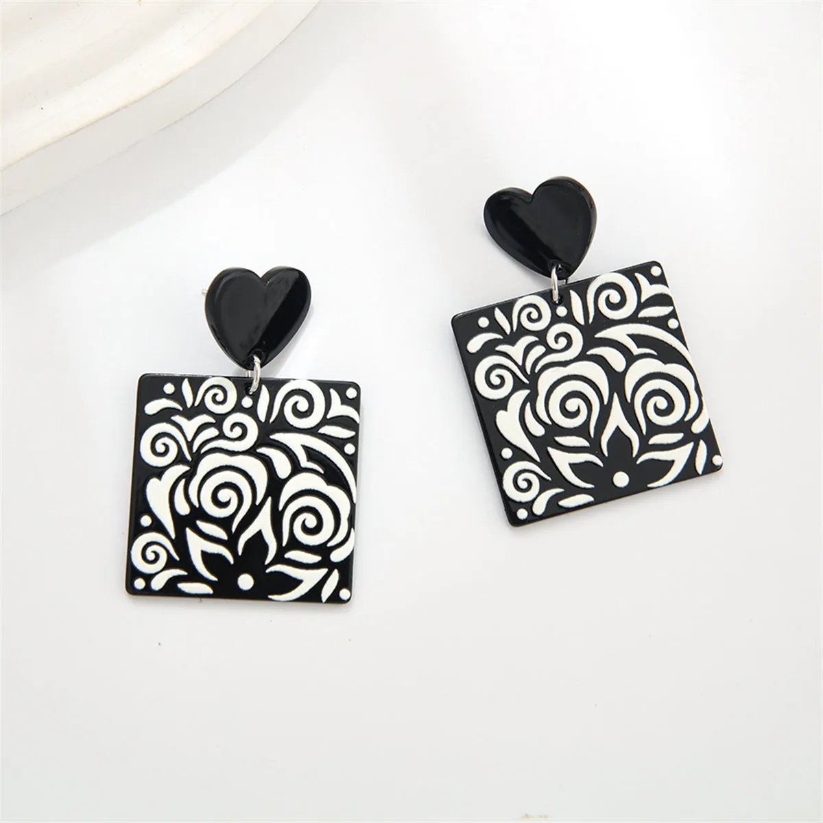 Black Acrylic Heart Swirl Earrings