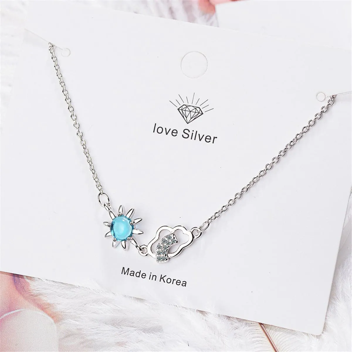 Blue Crystal & Cubic Zirconia Sun & Cloud Pendant Necklace
