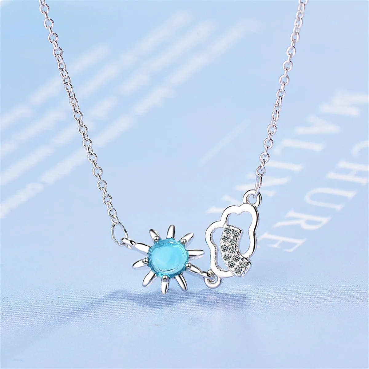 Blue Crystal & Cubic Zirconia Sun & Cloud Pendant Necklace
