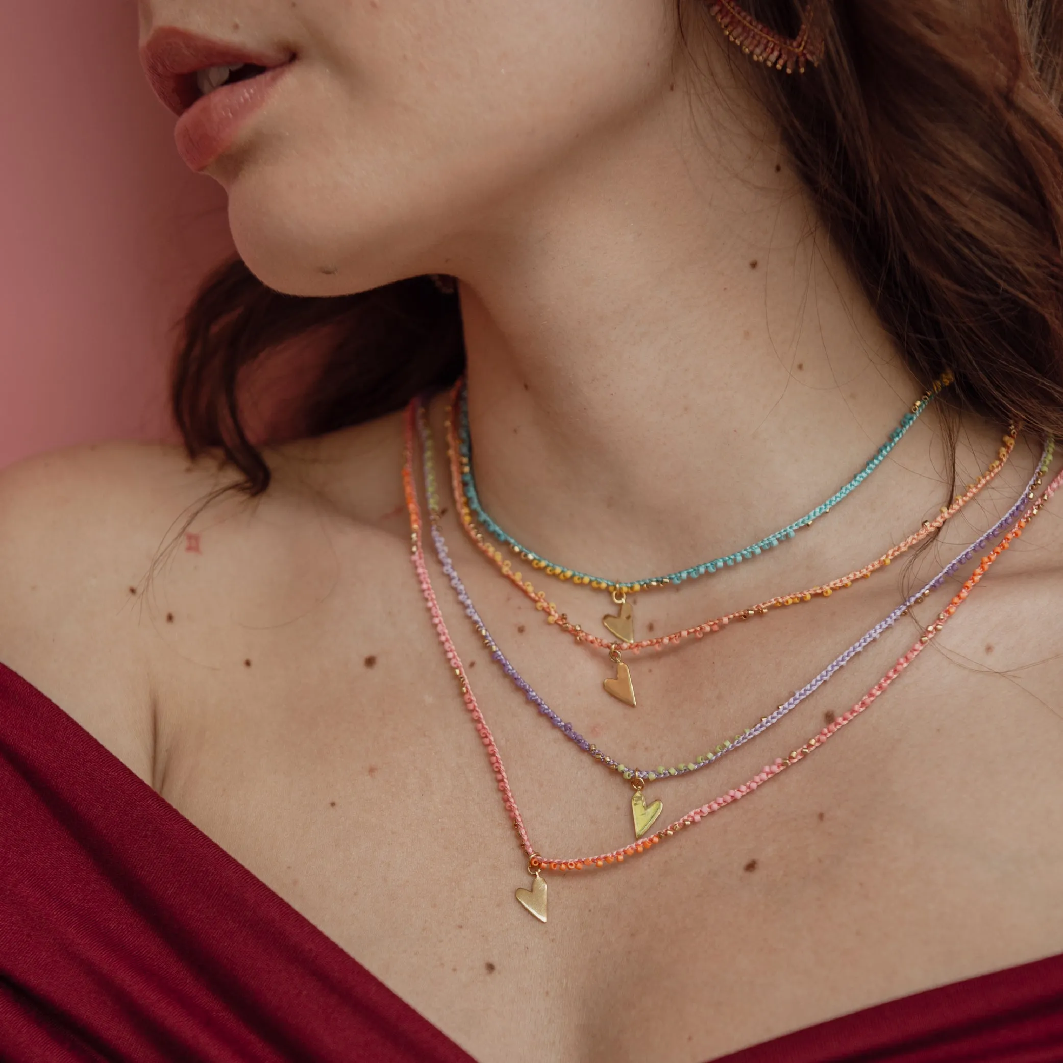 Breaded adjustable necklace with beads and gold plated heart charm