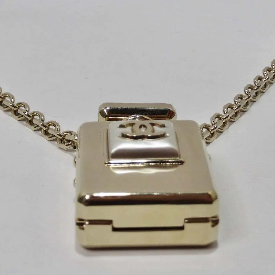 Chanel CC Gold Tone Perfume Bottle Locket Necklace
