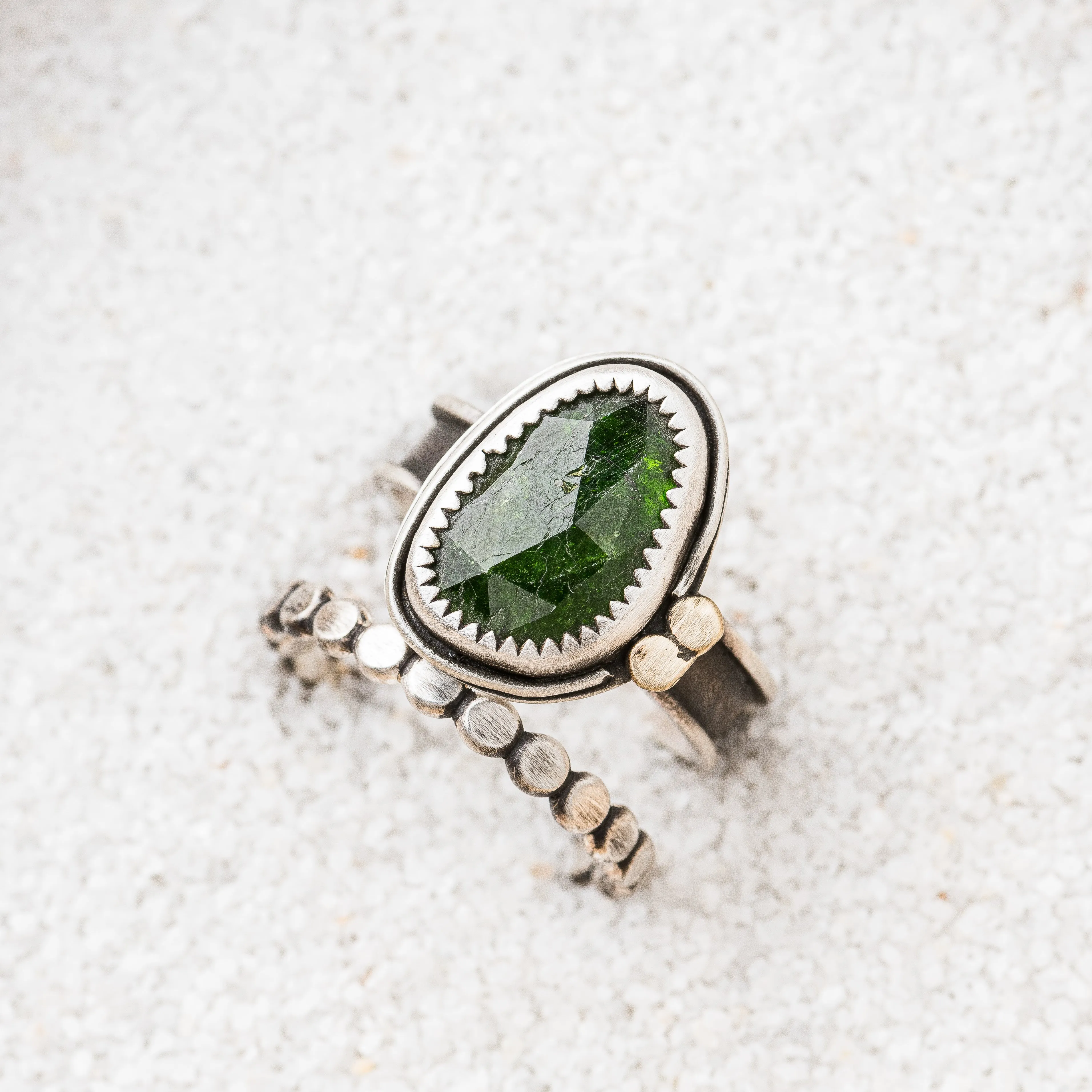 Chrome Diopside Ring with Bronze Discs on Channel Band
