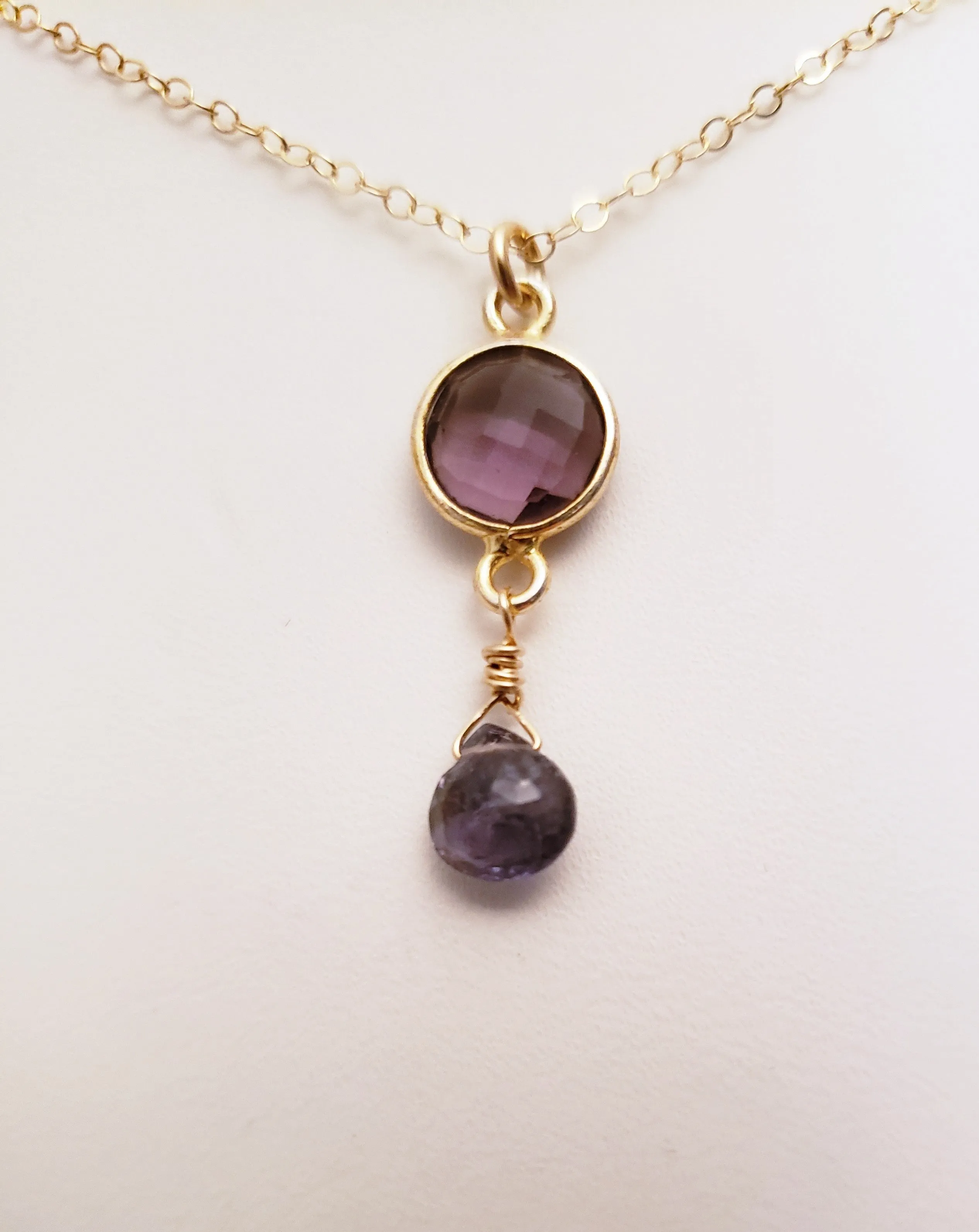 Delicate Pendant Necklace Features a Faceted Bezel Set Amethyst With a Faceted Iolite Tear Drop on a Fine Gold-Filled Chain.