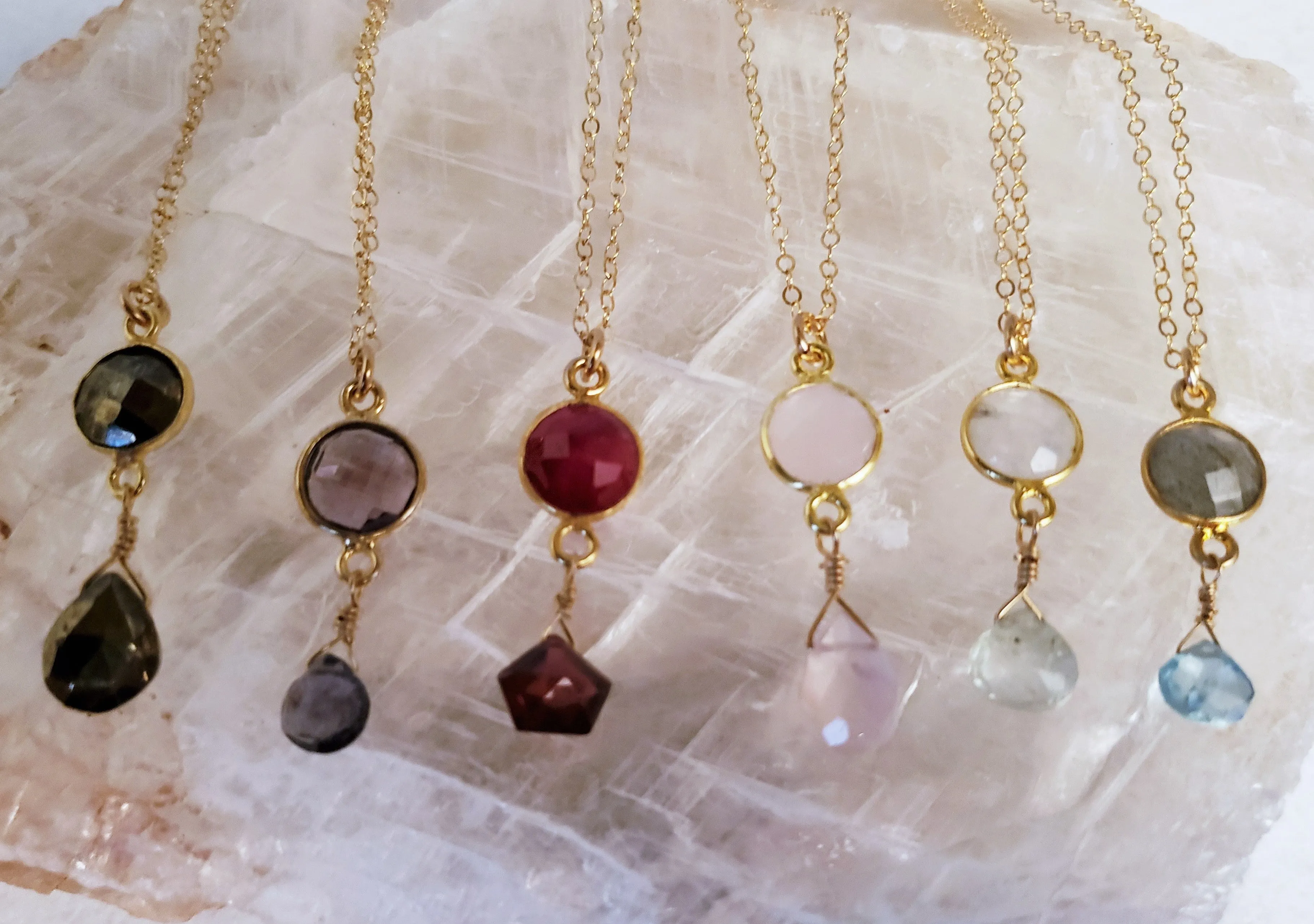 Delicate Pendant Necklace Features a Faceted Bezel Set Amethyst With a Faceted Iolite Tear Drop on a Fine Gold-Filled Chain.