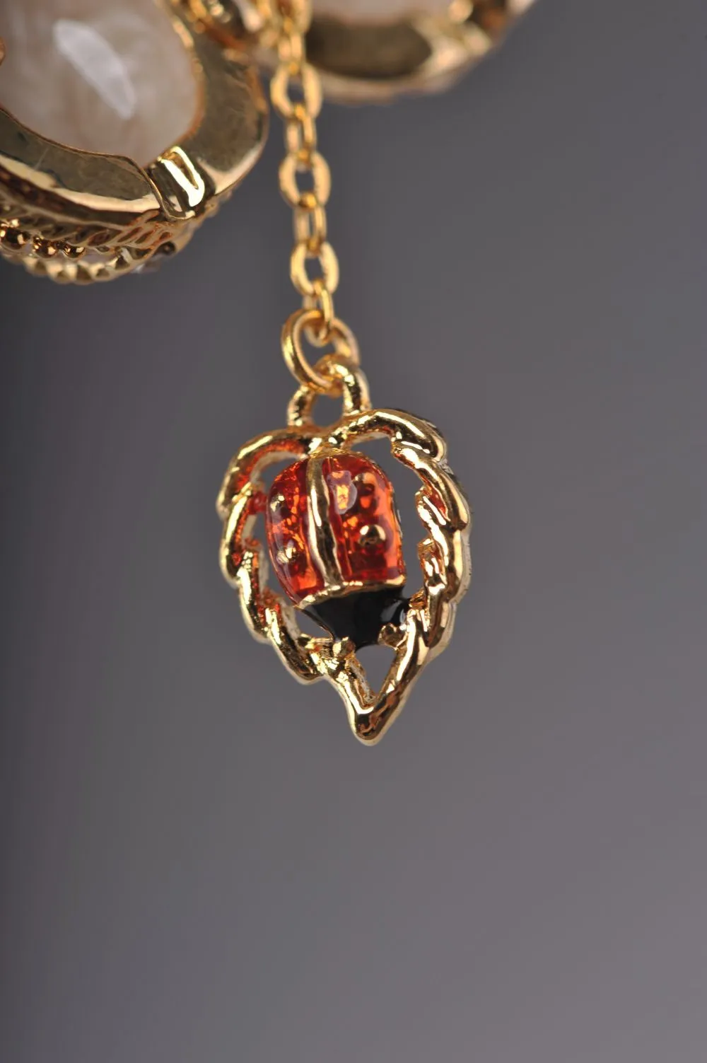 Moccasin Egg Pendant with a Beetle