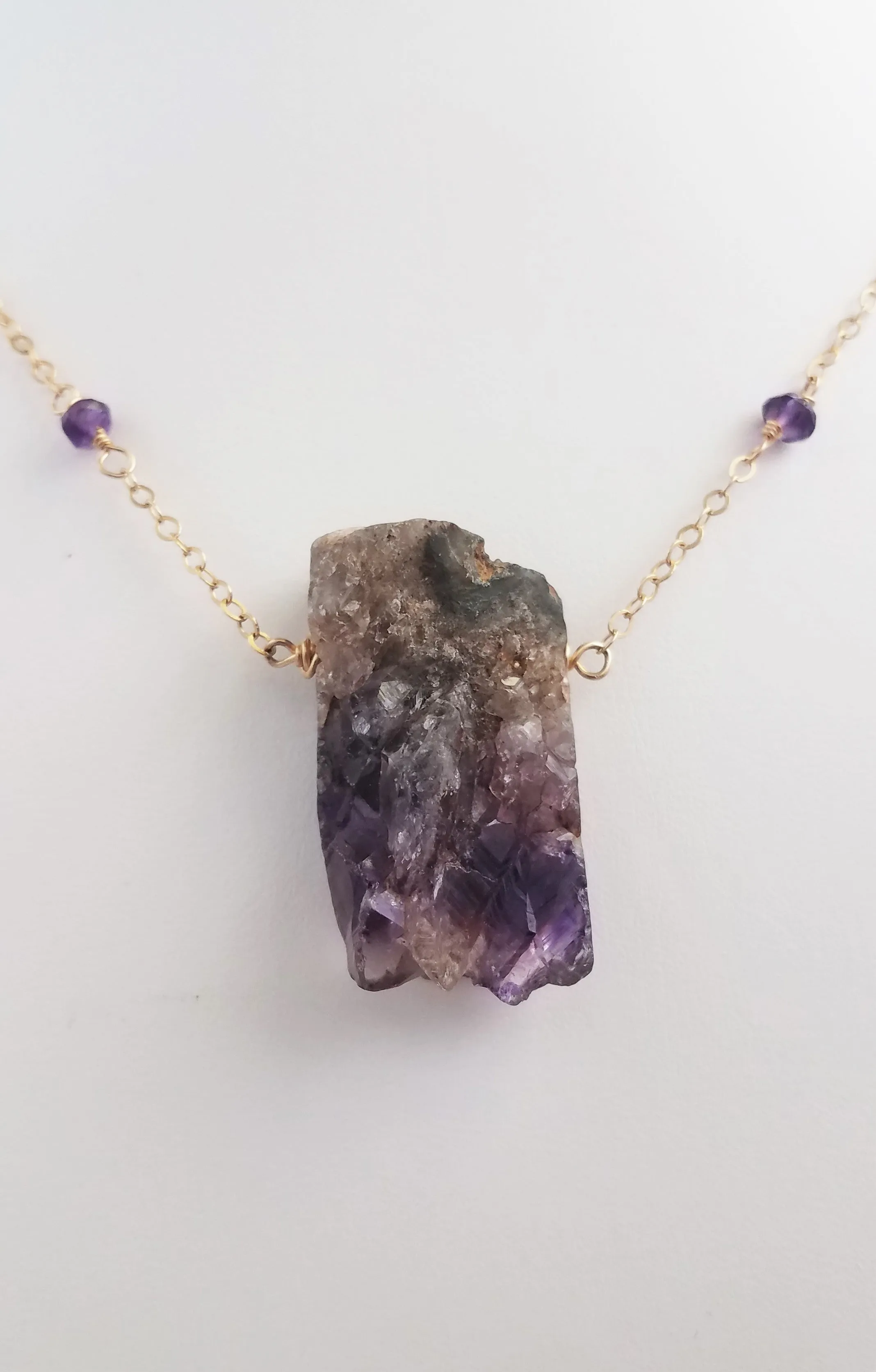 Raw Amethyst Nugget Pendant is Surrounded by Faceted Amethyst roundel on Gold-Filled Chain.