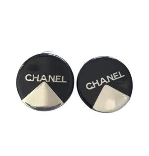 Vintage Chanel round earrings with silver and black mod design.